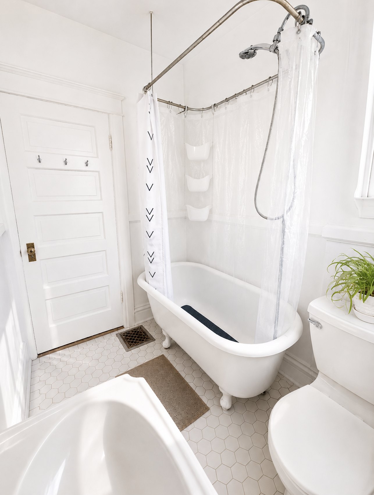 Bathroom with clawfoot tub and pedestal sink