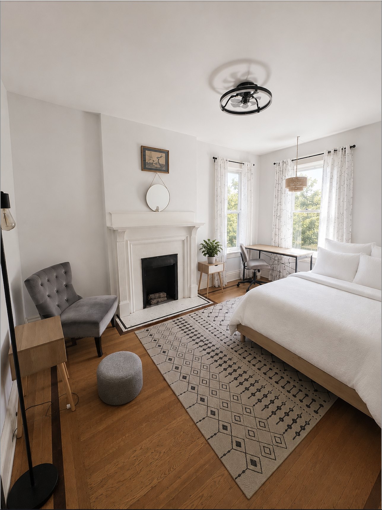 Private room with ornamental fireplace, sitting chair, and two windows