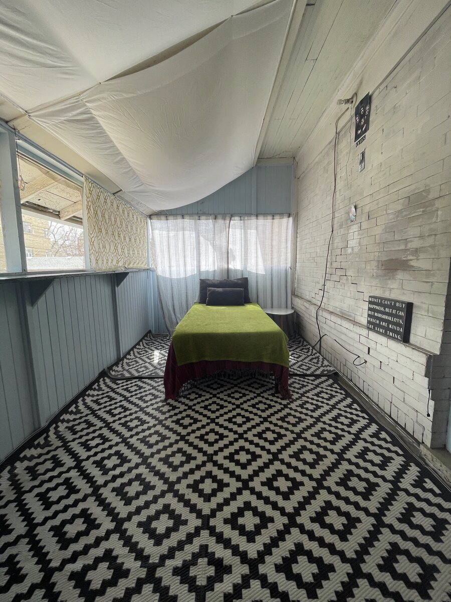 The private screened veranda off the second-floor east-facing room, overlooking the garden